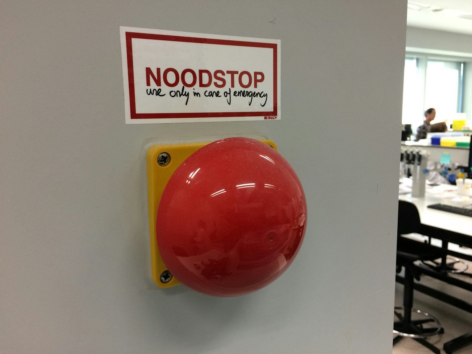 Red emergency stop button on a machine